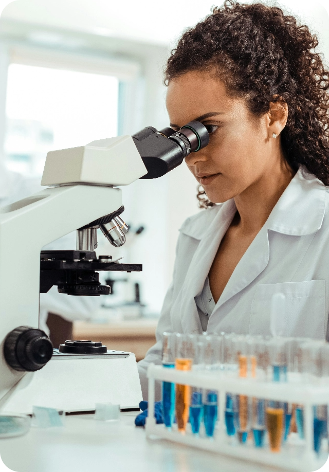 Research scientist using a microscope in a laboratory