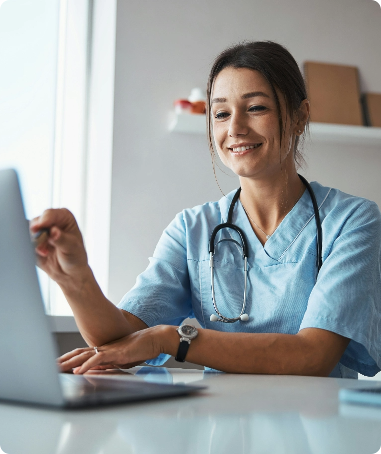 Clinical researcher working at a laptop